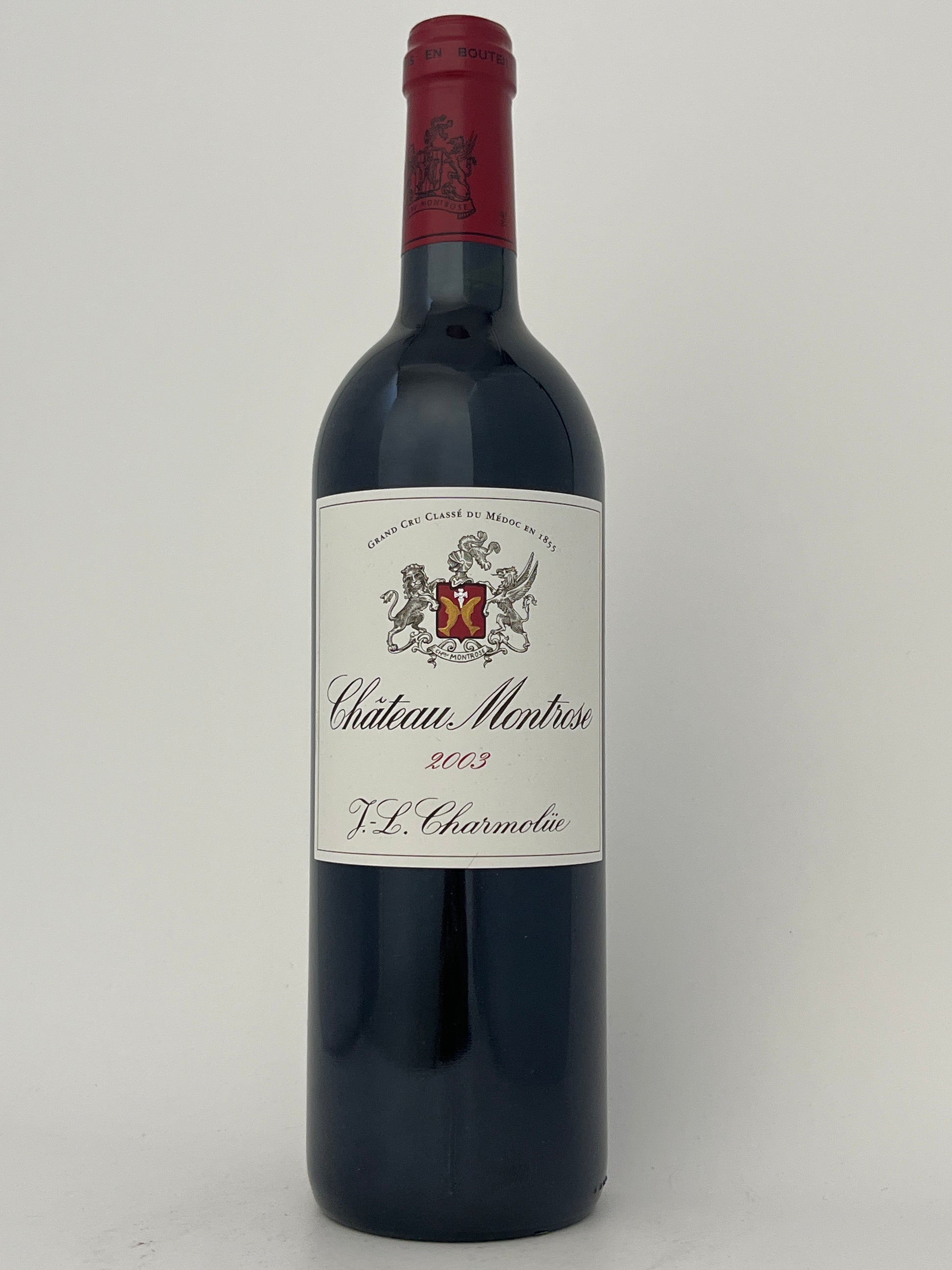 Bottle of Chateau Montrose, Cabernet Sauvignon, Saint-Estephe, Bordeaux, France 2003 in a white backround.