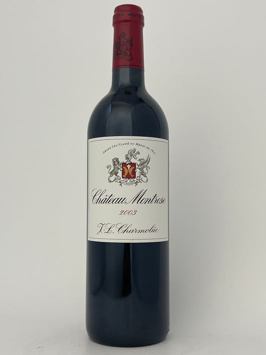 Bottle of Chateau Montrose, Cabernet Sauvignon, Saint-Estephe, Bordeaux, France 2003 in a white backround.