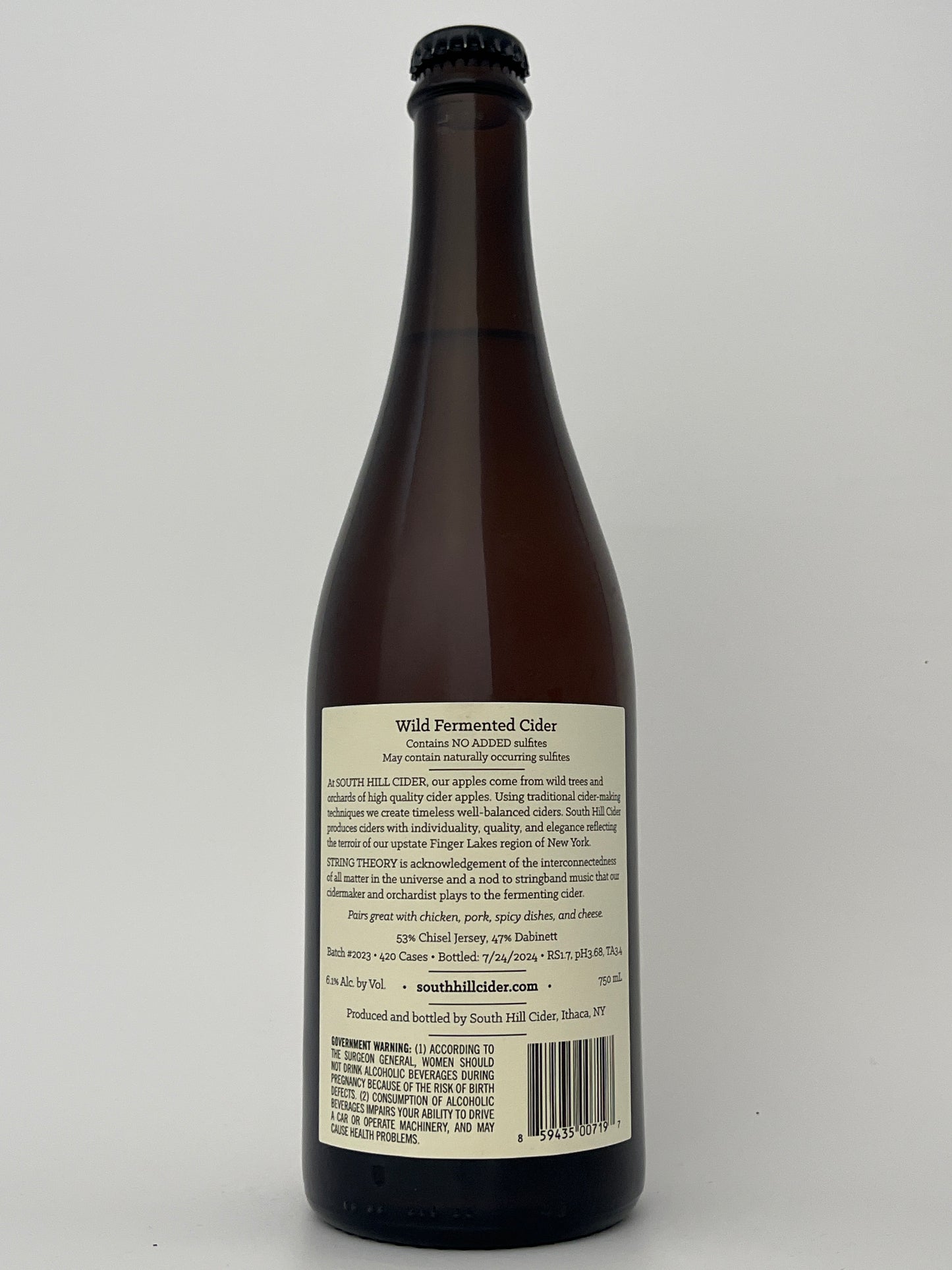 Back label of a bottle of South Hill Cider String Theory in a white backround.