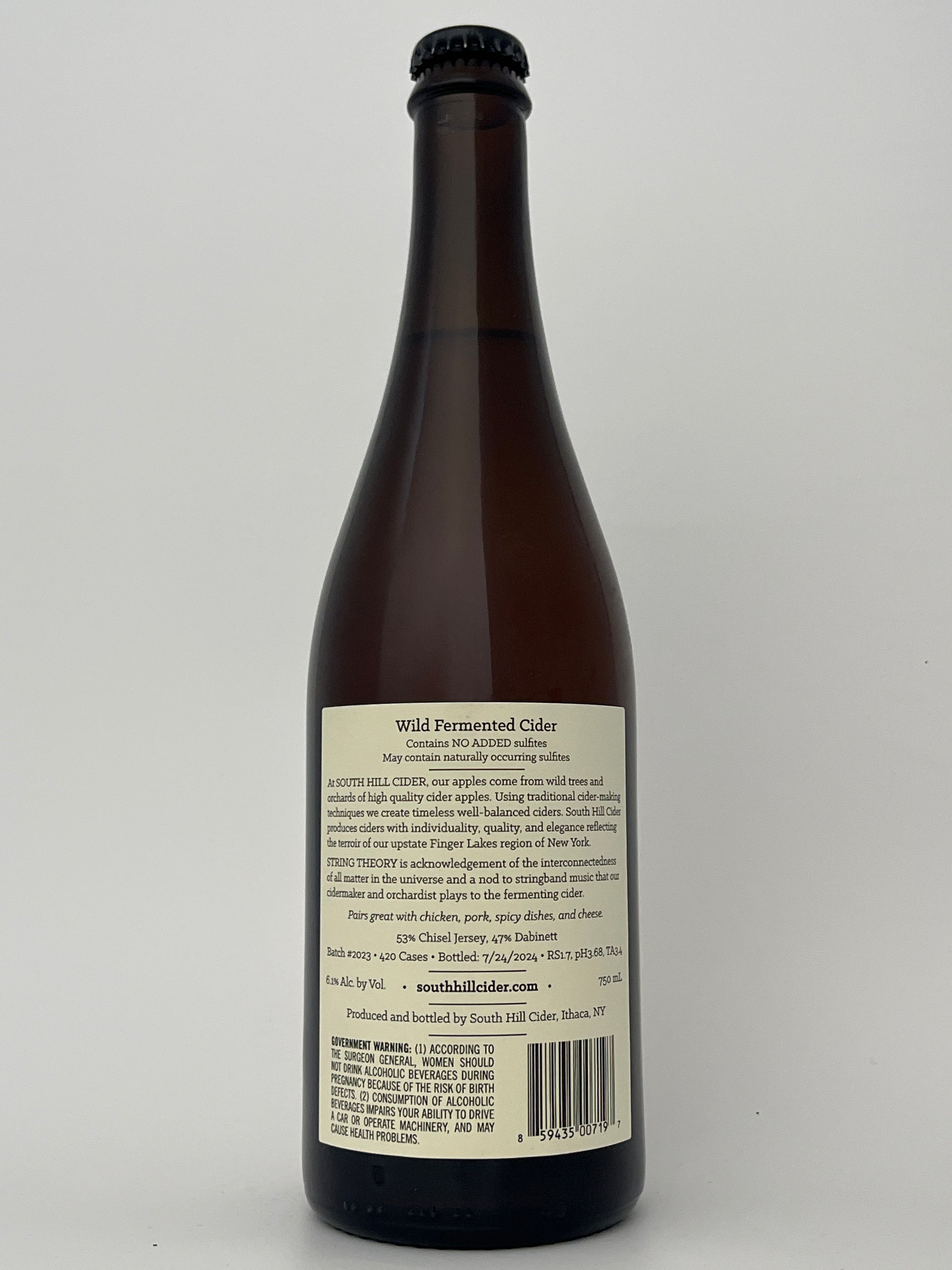 Back label of a bottle of South Hill Cider String Theory in a white backround.