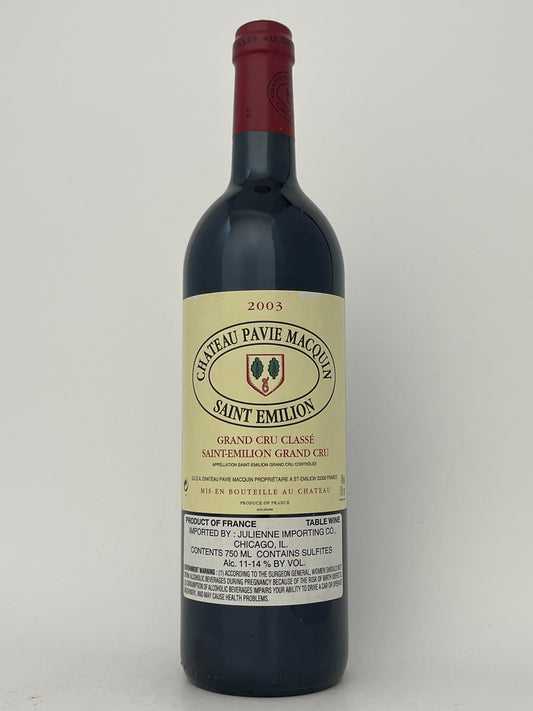 Bottle of Chateau Pavie Macquin, Merlot, Saint-Emilion Grand Cru, Bordeaux, France 2003 in a white backround.	
