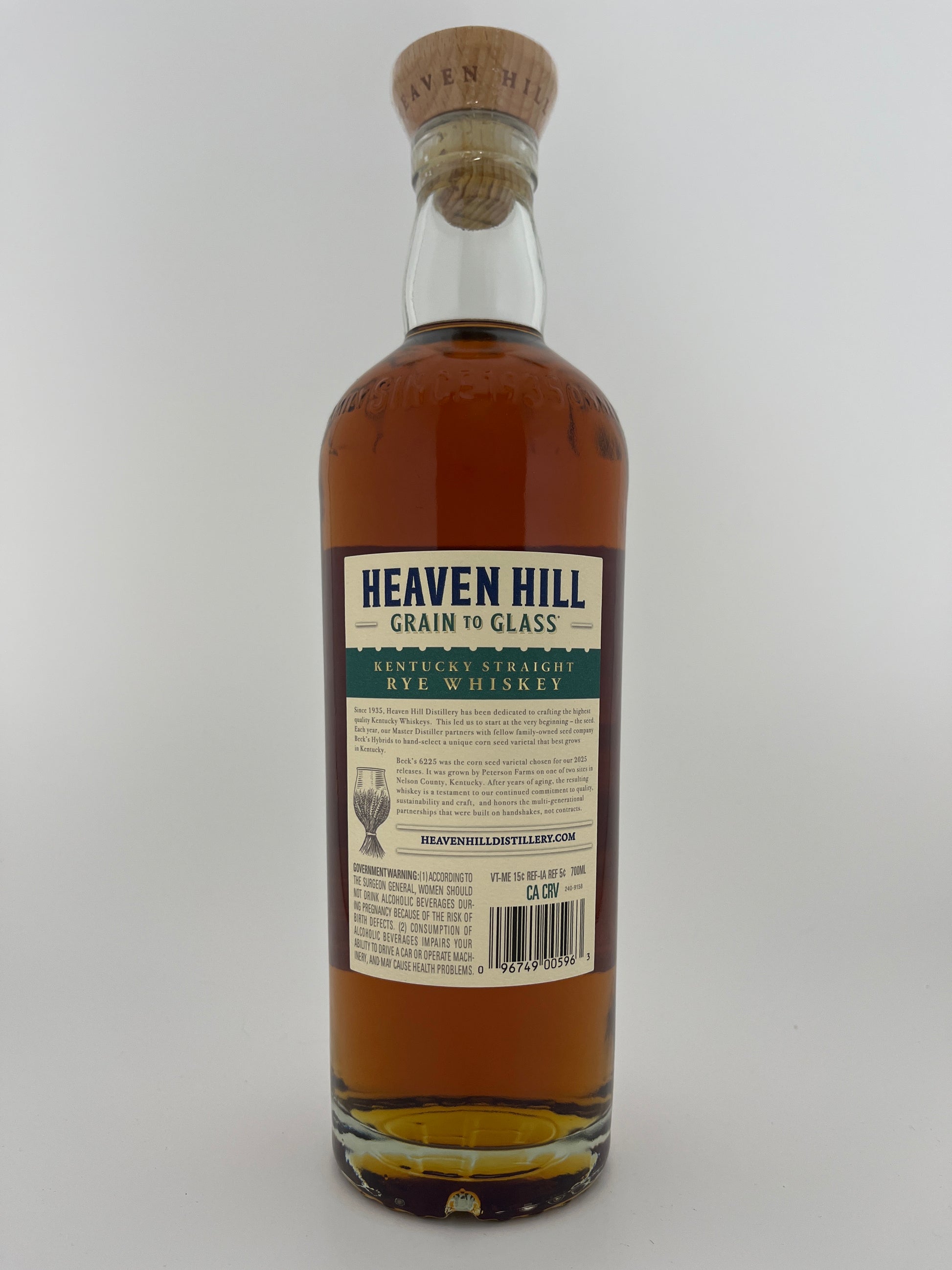 Back label of a bottle of Heaven Hill Rain to Glass Rye Whiskey on a white background