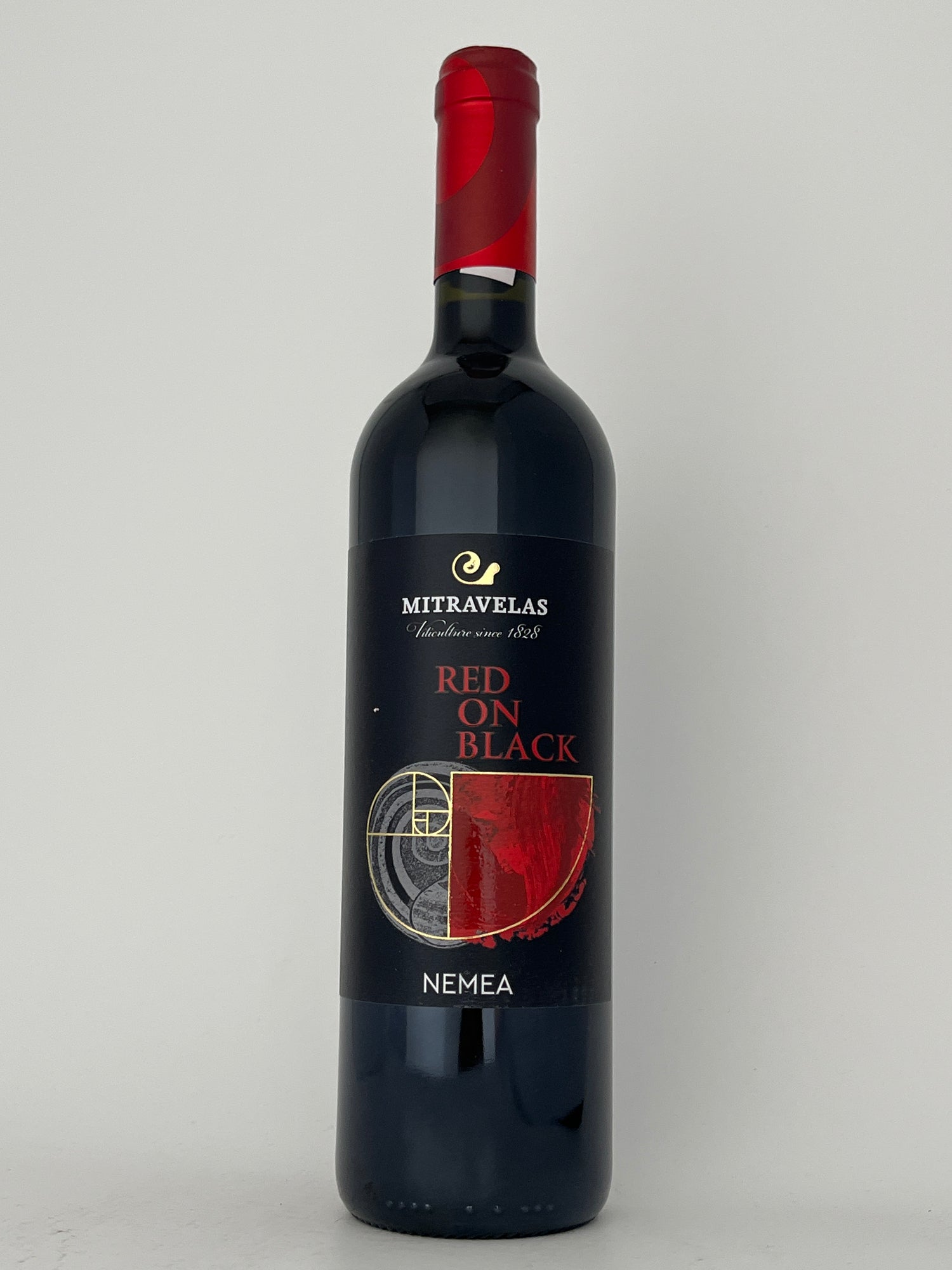 Bottle of Mitravelas, Agiorgitiko, "Red on Black," Nemea, Greece 2023 in a white backround.