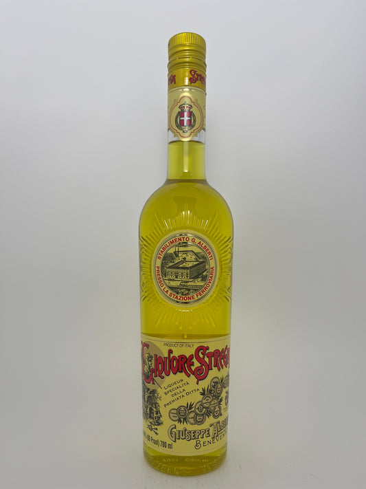 Bottle of Strega in a white backround.